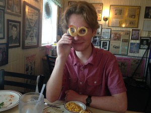 Liam playing with his food: curly fries at Peggy Sue's 50's Cafe in Barstow, CA.